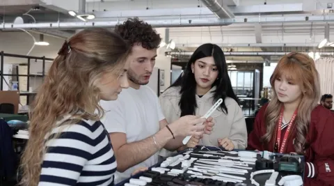 beacon students examining design